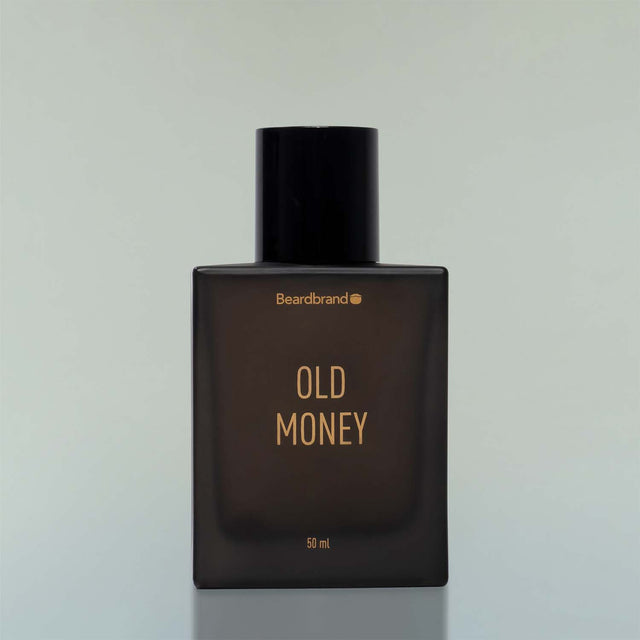 An square bottle of Beardbrand Old Money Eau de Parfum against a grey background.